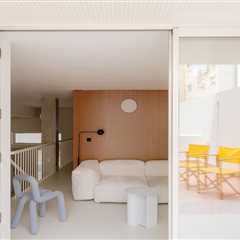 The Staircase in This Small Spanish Apartment Hides a Secret Toilet