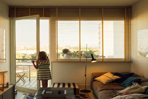 Plywood Built-Ins Reframe a Family’s Flat at a Revered Modernist Development in Lisbon
