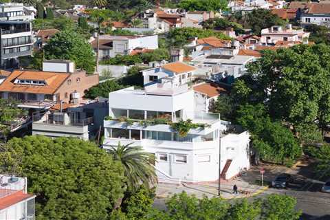 Budget Breakdown: A Buenos Aires Couple Build an Airy Live/Work Home Atop Mom’s Office for $153K